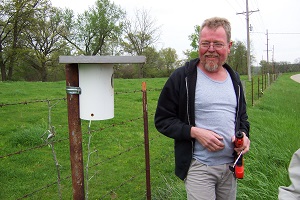 Jim with a nest box occupied by bluebirds.