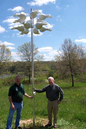 Park Superintendent, Greg Pittz, and John McDaniel with the twelve gourd setup for Purple Martins at Yellowstone Lake State Park. CarolPark Superintendent, Greg Pittz, and John McDaniel with the twelve gourd setup for Purple Martins at Yellowstone Lake State Park.